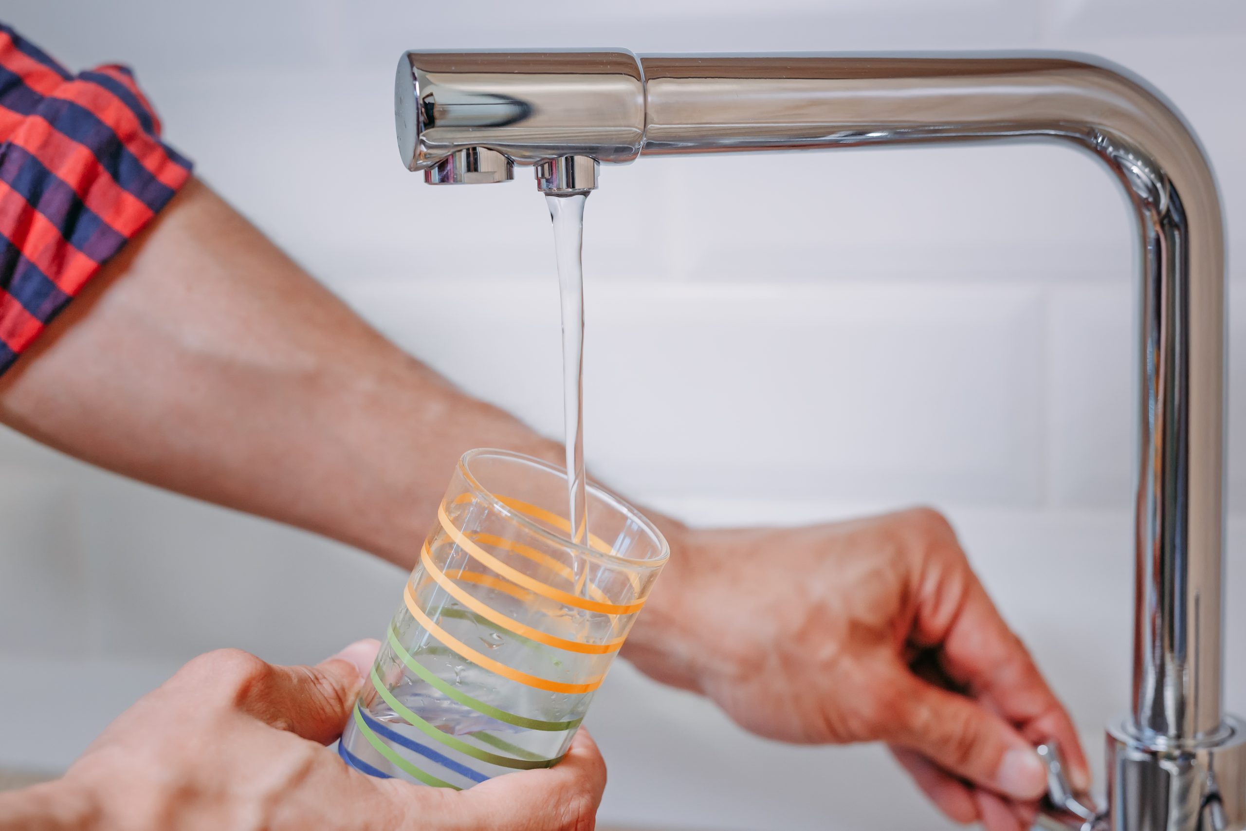Clean, filtered drinking water poured at home